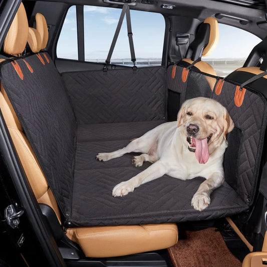 A Labrador comfortably resting on a Ruffrover 2.0 dog car seat protector, keeping the car clean and pets safe.